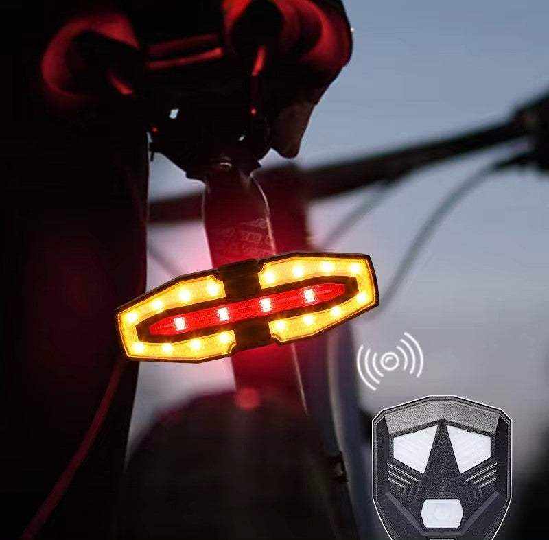 Pack Seguridad Total con luz trasera para bicicleta, carcasa negra y señales luminosas rojas y amarillas intermitentes.